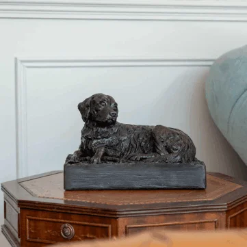 A delightful sculpted golden retreiver urn